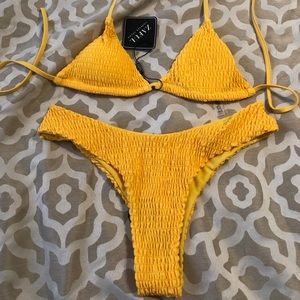 Yellow smocked bikini size medium.